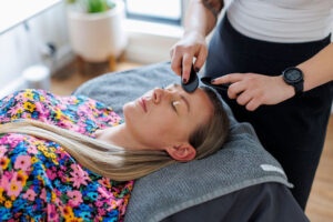 A patient having Gua Sha during a cosmetic acupuncture appointment, an example of what to expect 