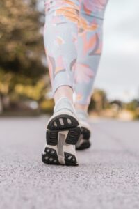 Image of a woman walking to get in some movement because movement matters for your health