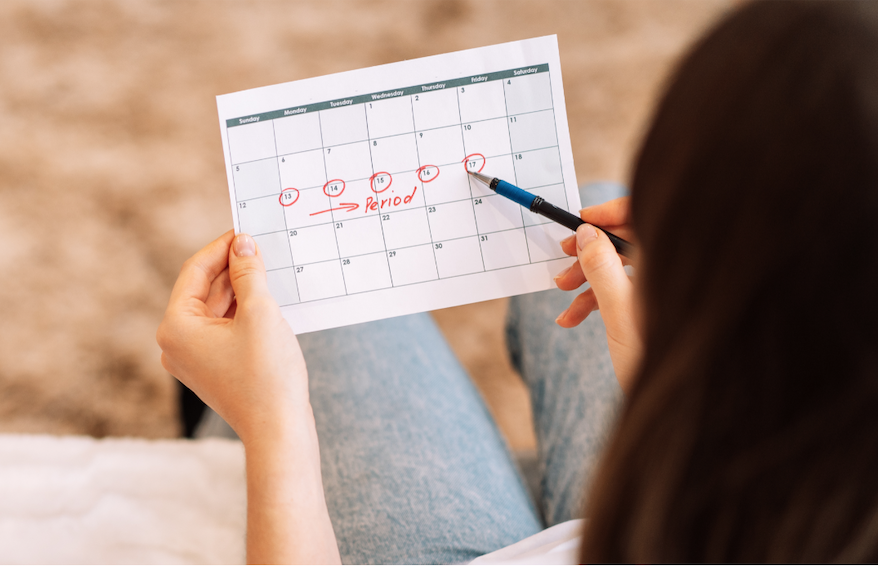 Woman tracking her period to count the length of her Luteal Phase